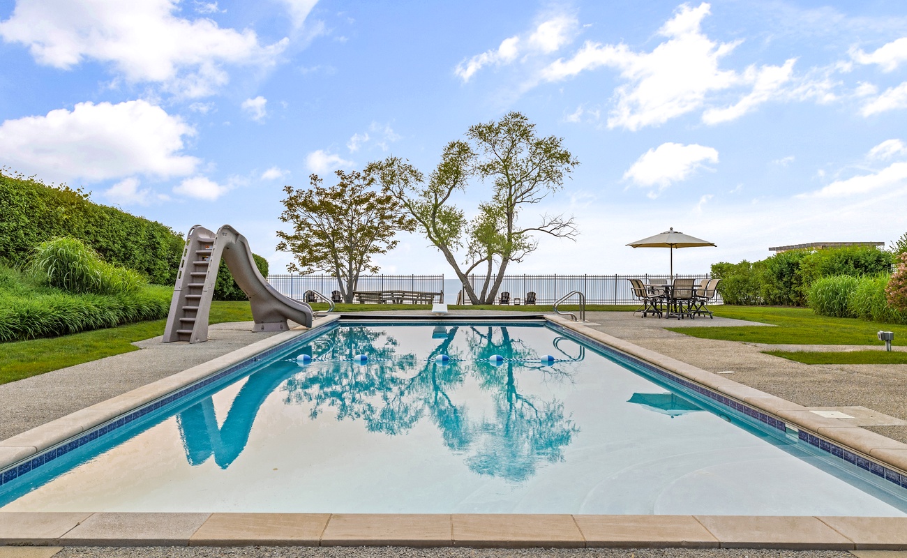 Sunset Manor's relaxing pool comes with a custom slide, a diving board and - a view!