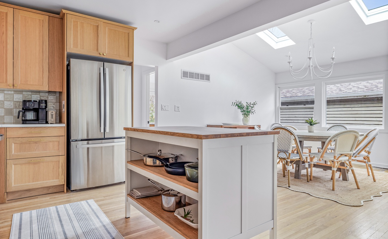 Bright mornings start here! Brew coffee, soak in the sun under skylights, and gather ‘round for slow breakfasts in sunlit, stylish kitchen + dining nook.