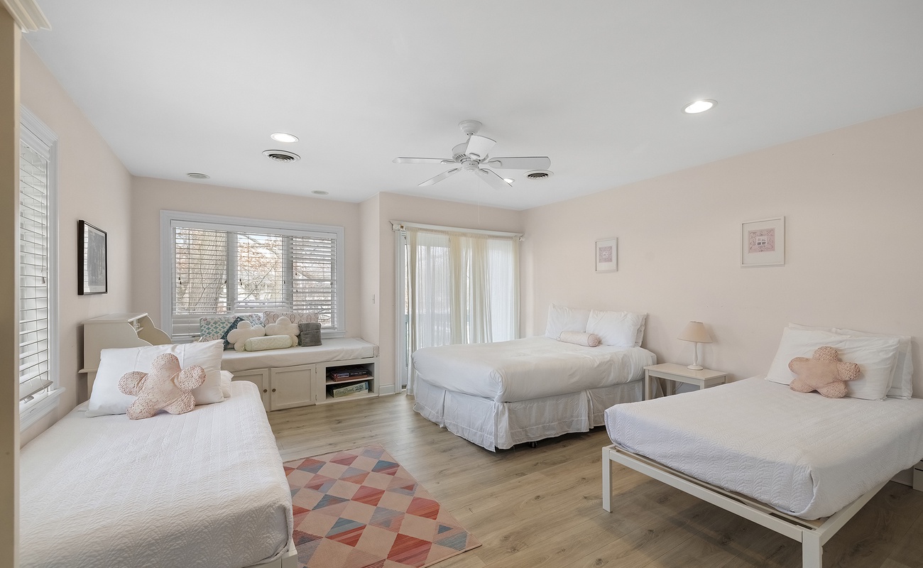 Bedroom 4 is on the upper level and has 1 queen and 2 single beds.