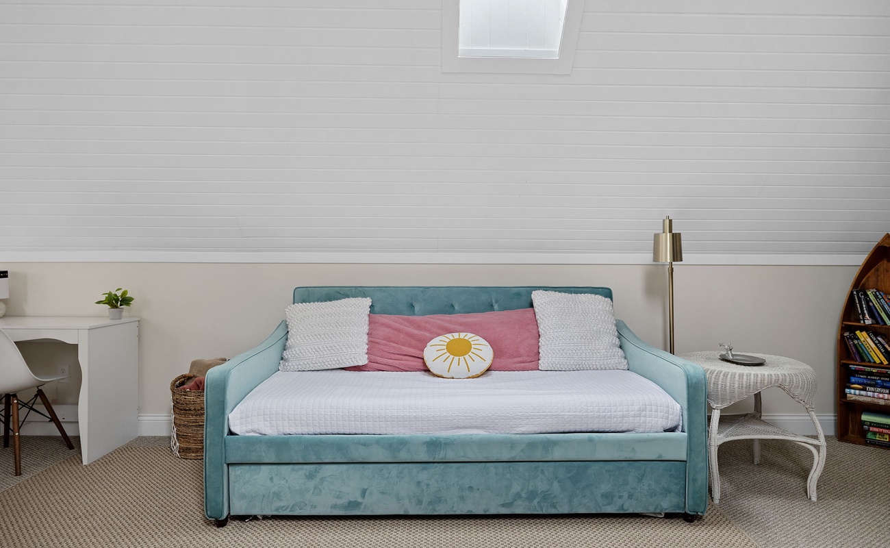 That very same upstairs family room couch turns into a sleeper sofa. Voila!