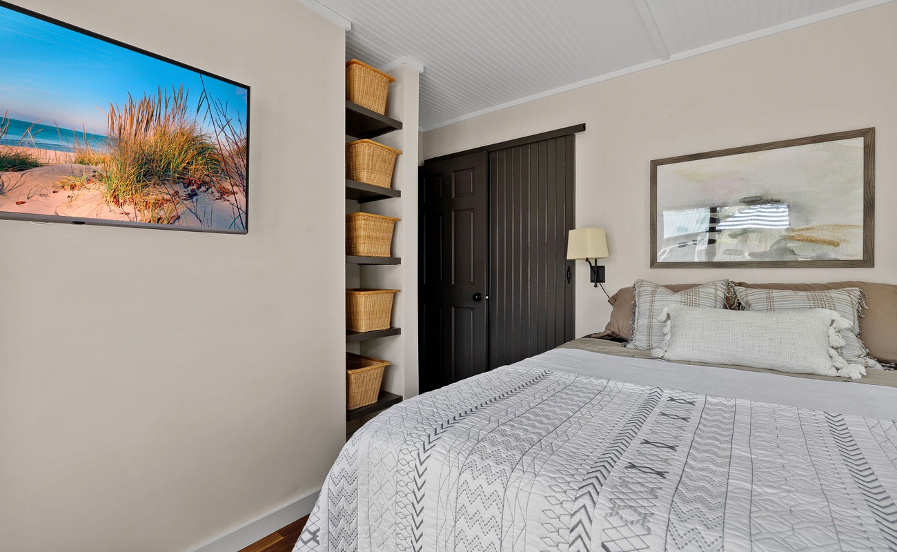 The Primary bedroom has a queen-size bed.