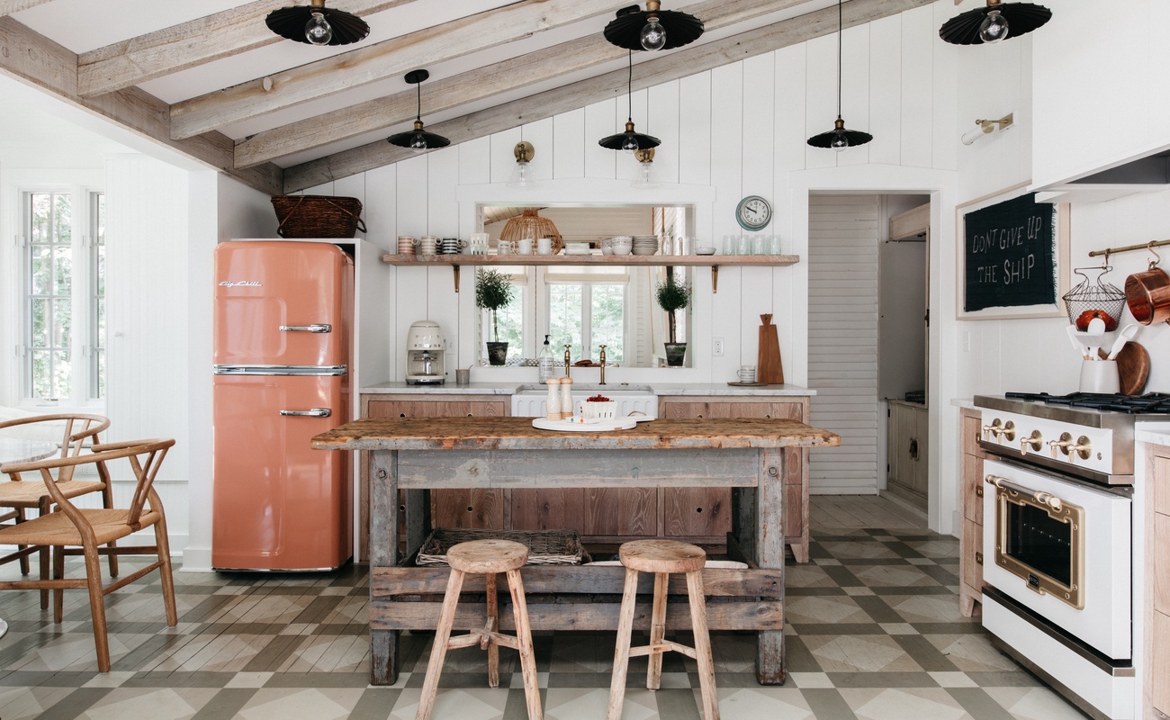 The kitchen has been updated to include many modern amenities while still retaining a vintage lake house feel.