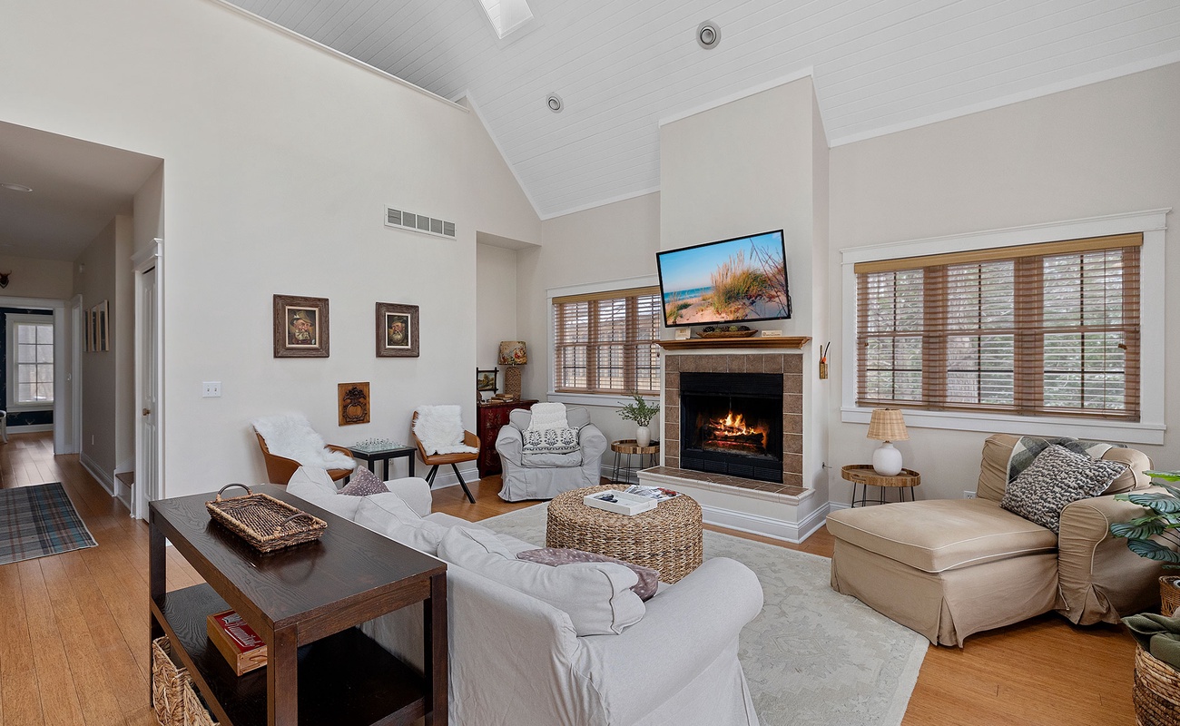 Seating options galore in the living room. A fire, glass of wine, a movie. Boom.