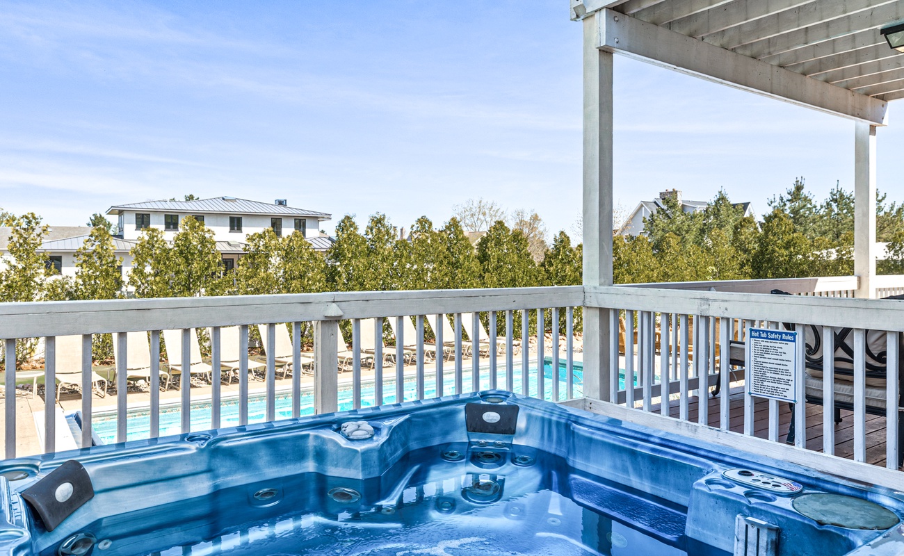 Soak in style with pool views and blue skies all around.