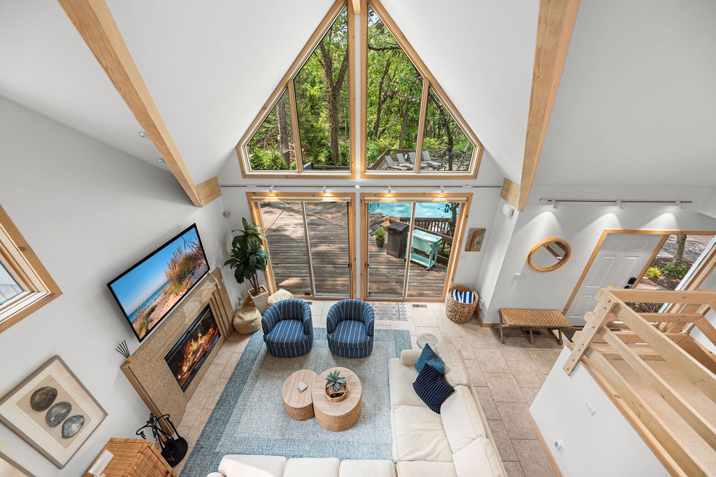 Soaring ceilings, forest views, and your own pool just steps away