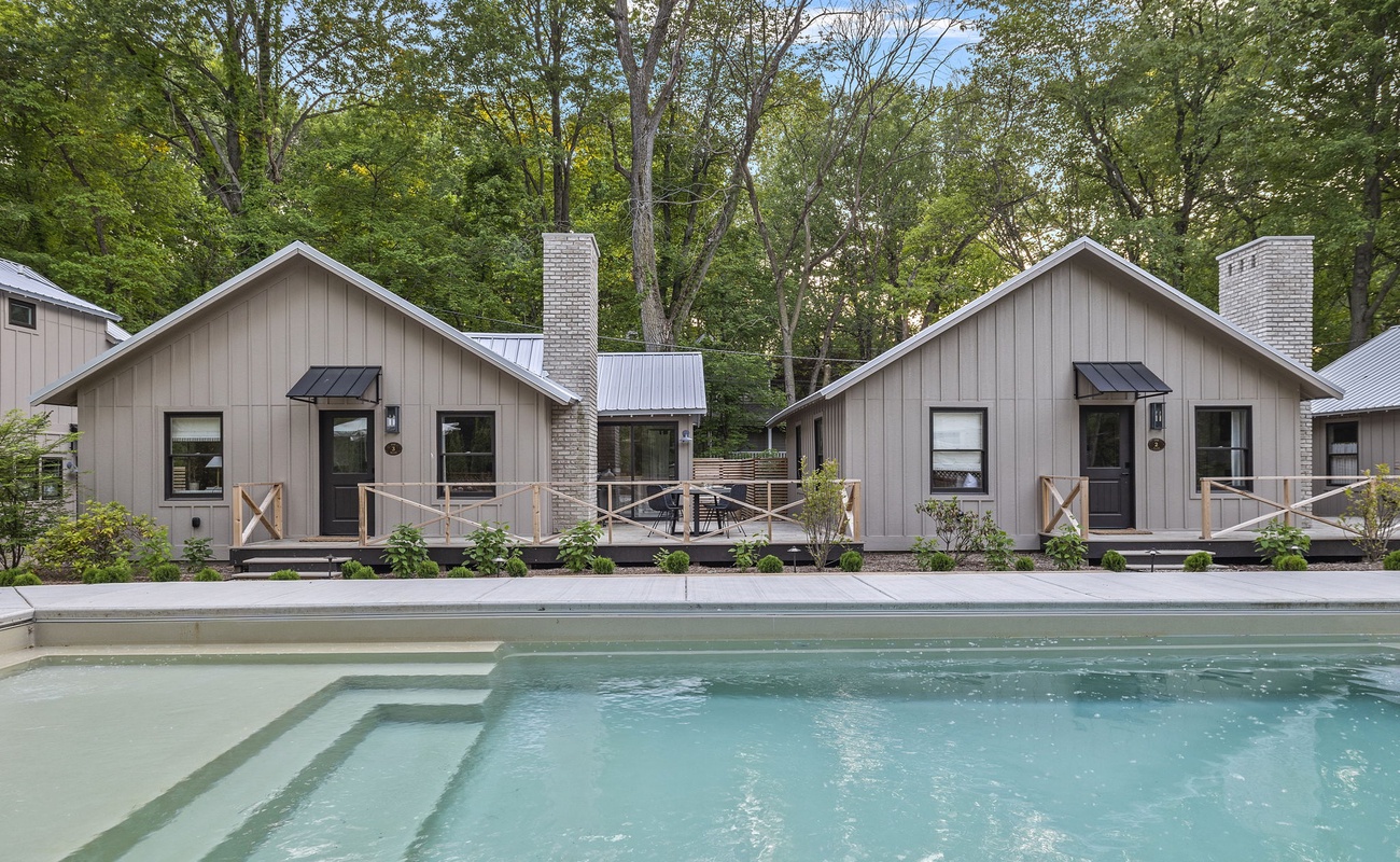 Embracing the beauty of nature at the Townie's cottage with its charming pool and cozy cabins.