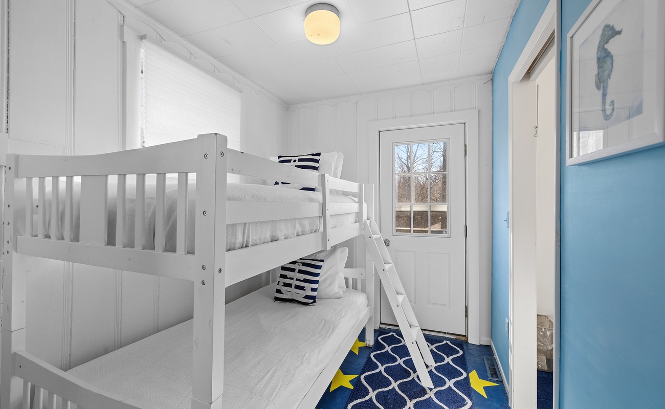 Bedroom 5 is on the upper level and has a single bunk bed.