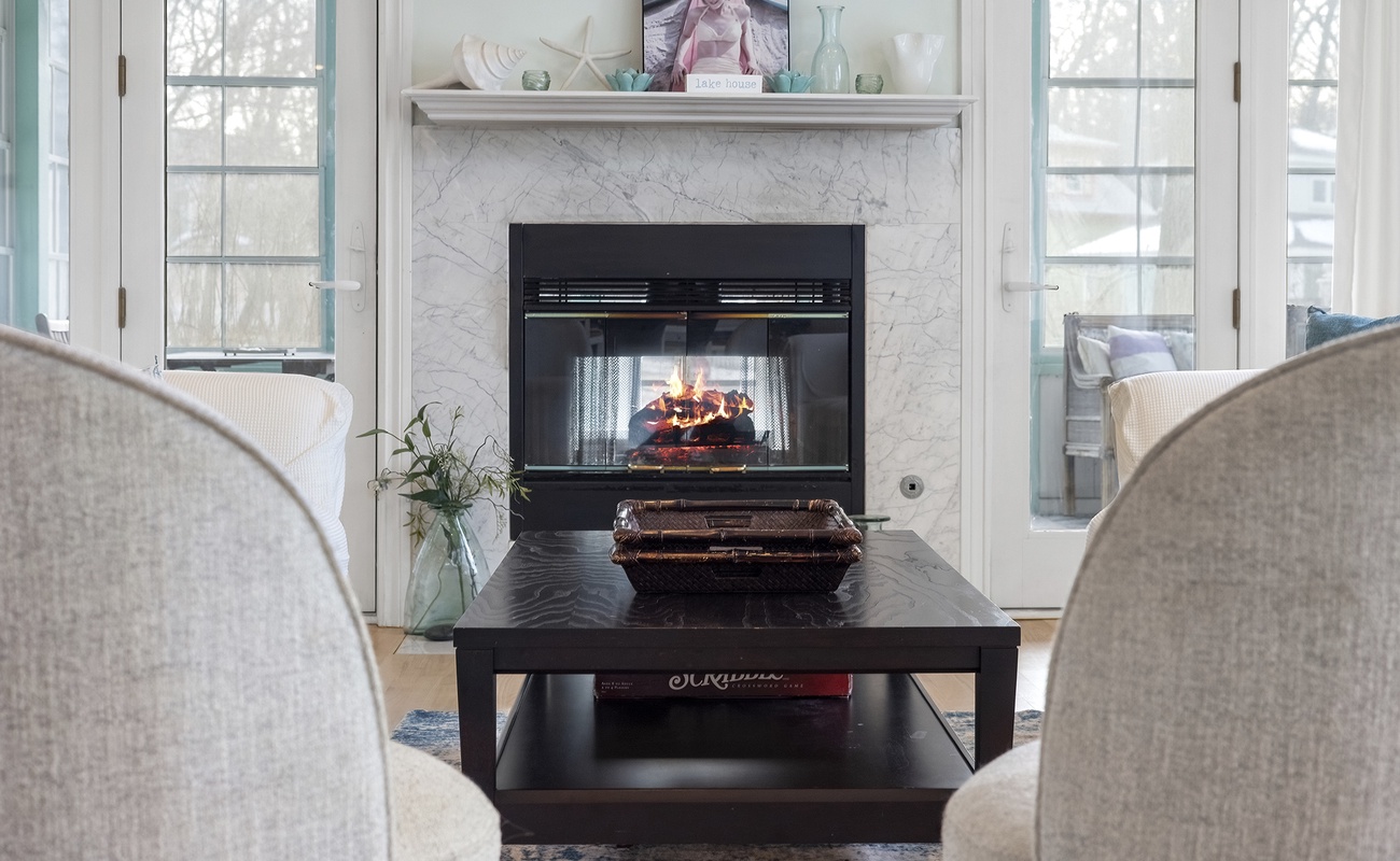 Main living area with coastal decor creates the perfect retreat (fireplace not available for guest use).