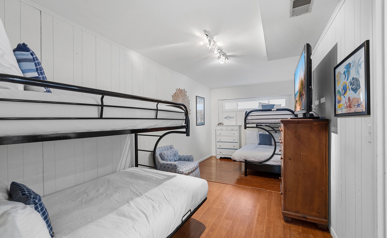 Bedroom 6 is on the lower level and has a 2 single bunk beds.
