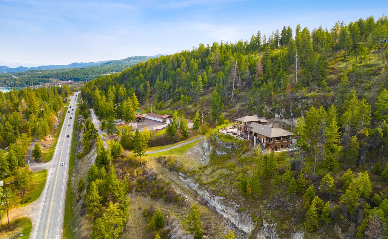 Life’s better when your backyard is a forest and your driveway hugs a cliff.