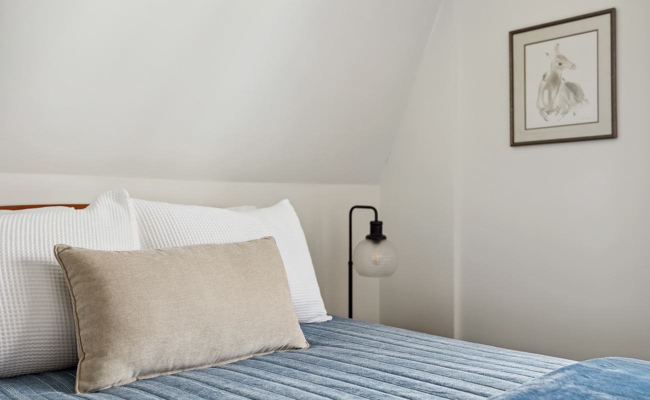 Sink into plush pillows and cozy comfort for a restful stay.