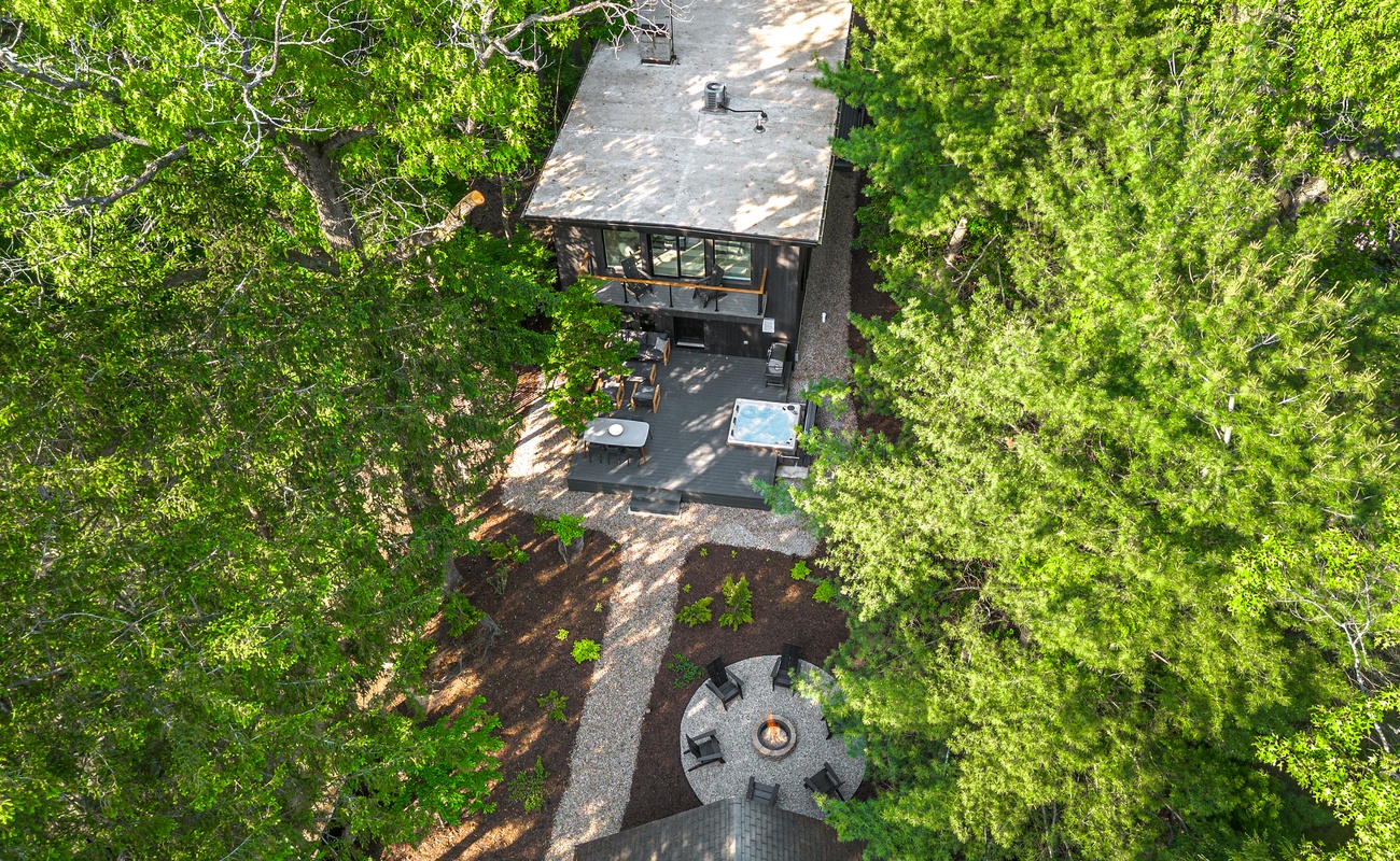 Tucked beneath the trees where modern comfort meets nature.