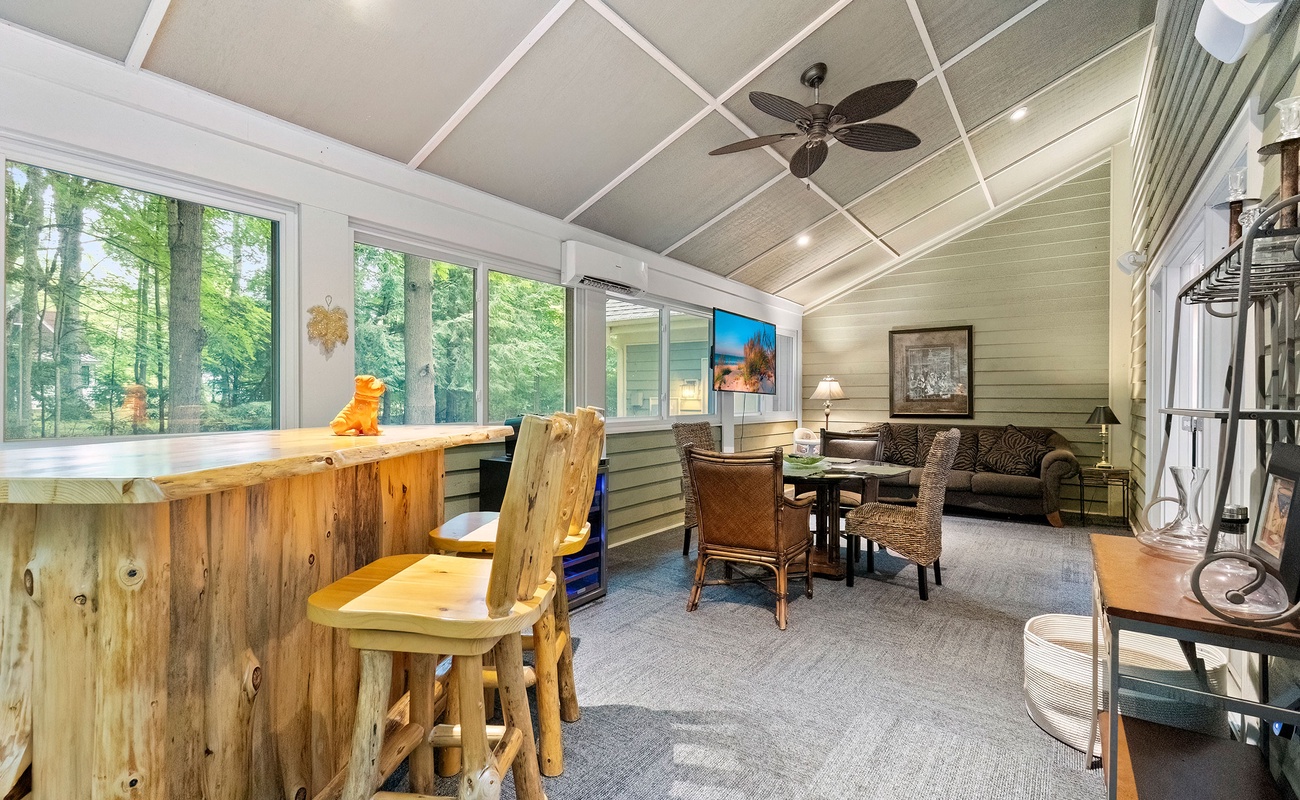 An eclectic handmade bar and stools. Woodland views off the charts. Mm-mm, good.