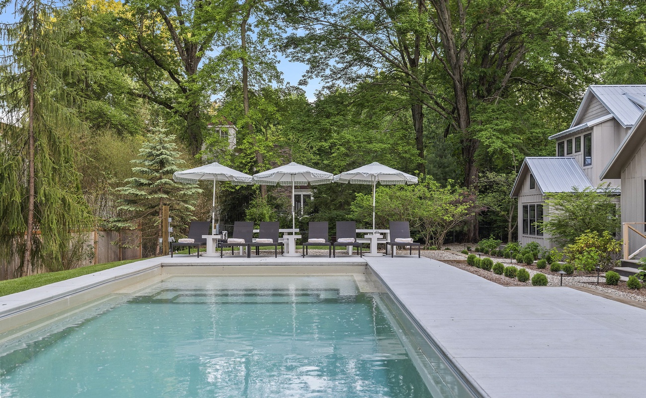 With a pool to cool off and a lawn to lounge on, every day feels like a vacation.