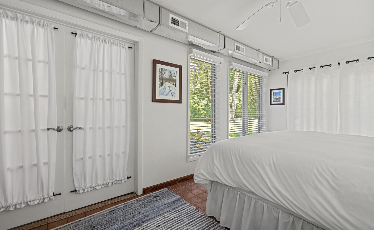 Wake up surrounded by light in this airy retreat, where restful sleep is a given.