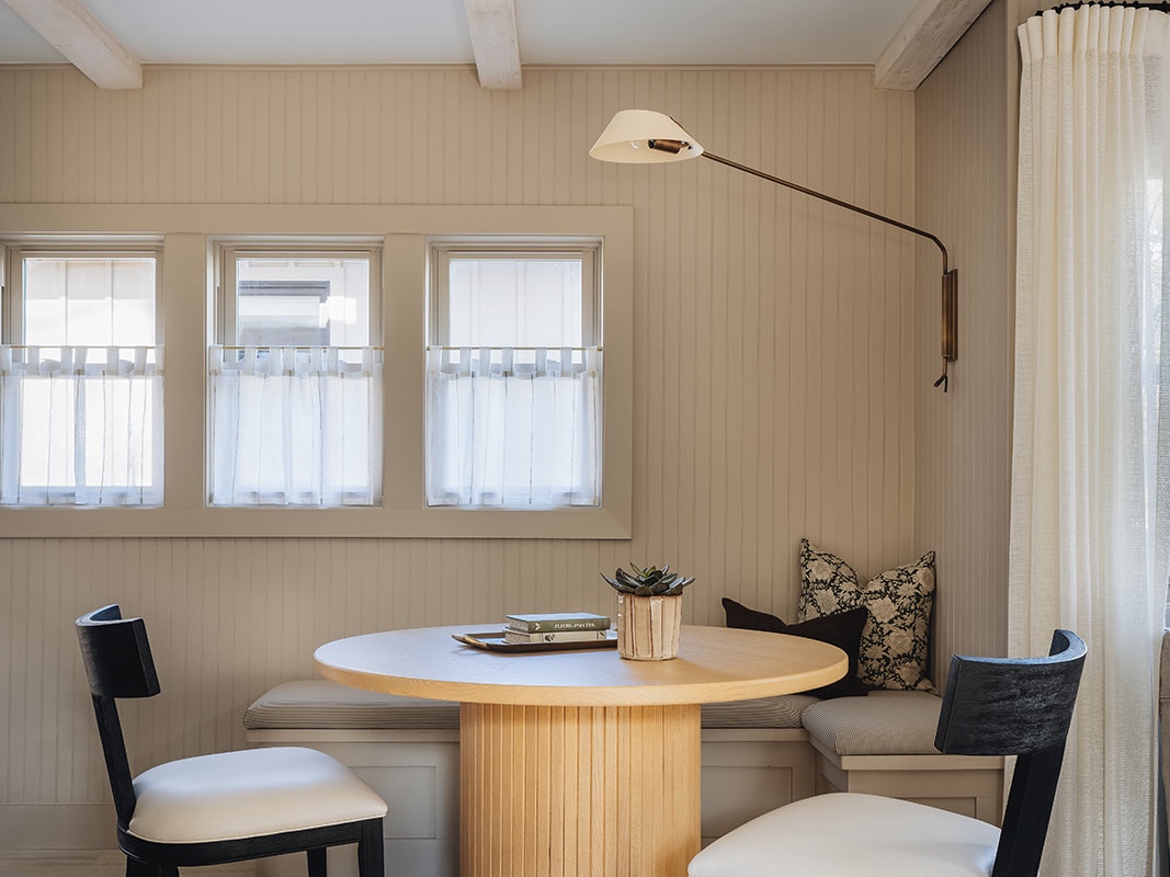 The sweet breakfast nook can double as a game table for you and your guests.