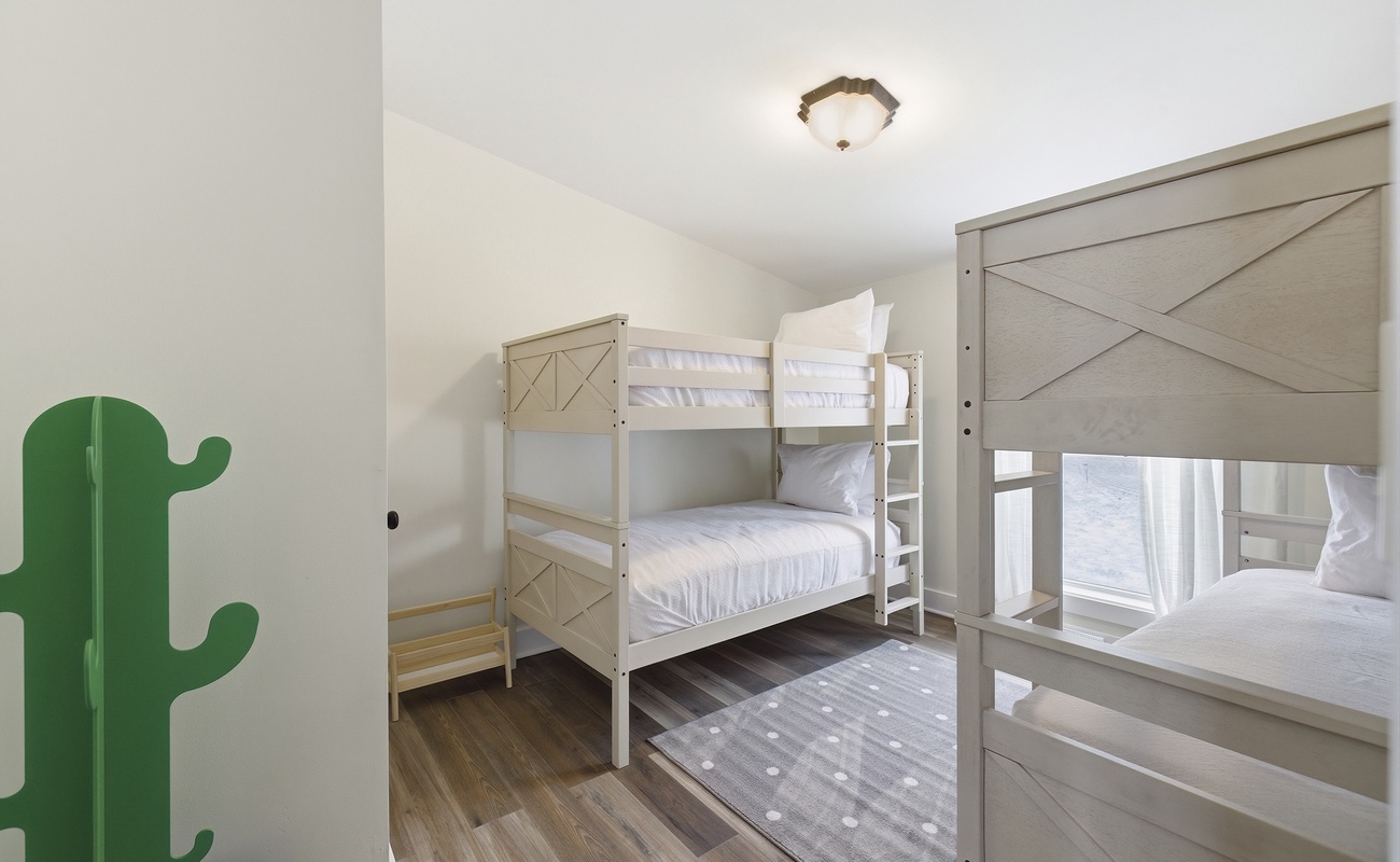 Modern bunks and a playful design make this the perfect space for kids.
