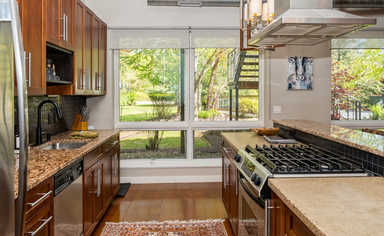 Sunlit kitchen with scenic views and chef-worthy style!