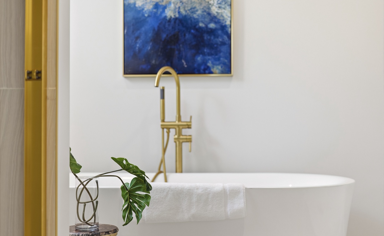 Treat yourself to a long, relaxing bath in this elegant modern suite.