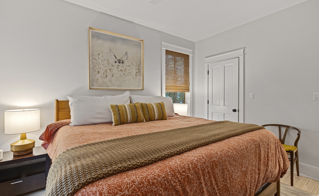 The primary bedroom is on the main level & has a king-sized bed.