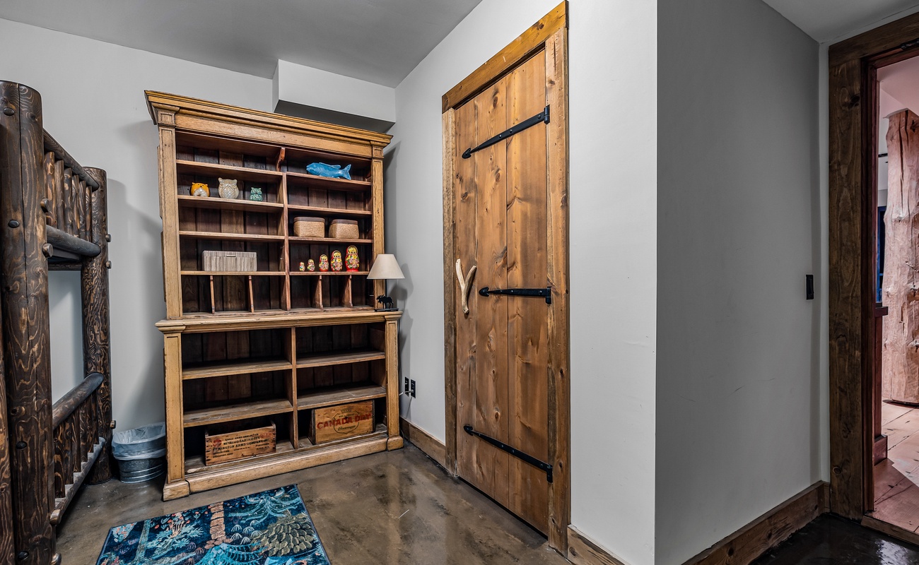 This serene space with a wooden door and bookcase invites you to unwind.