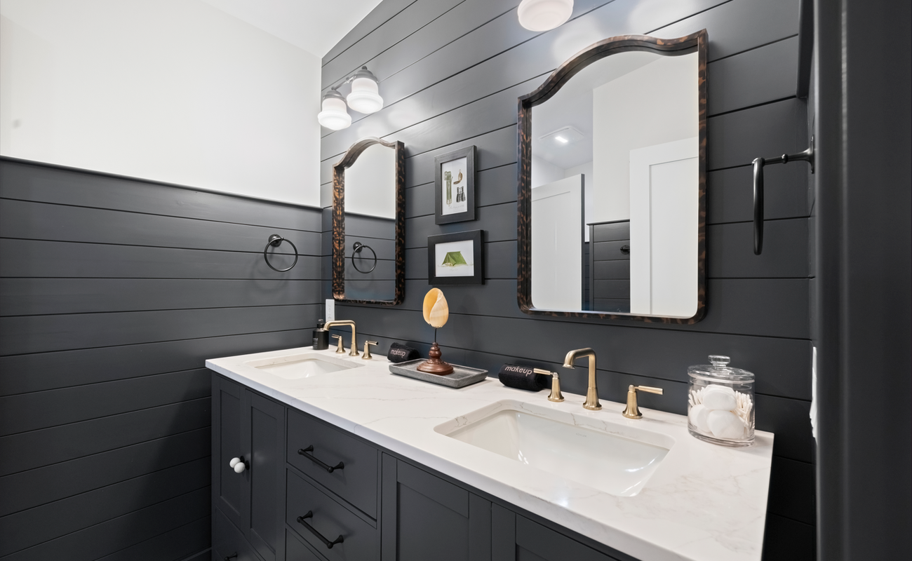 The Woodsmen’s bath blends timeless detail with calm symmetry.
