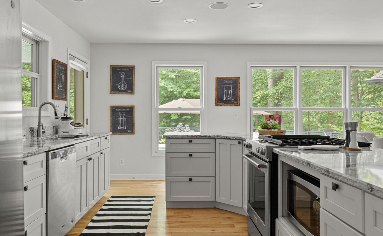 Cook up culinary delights in this bright, modern kitchen with a view.