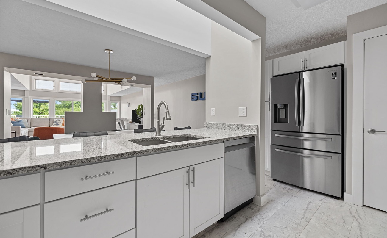 Whipping up culinary magic in this sleek, modern kitchen!