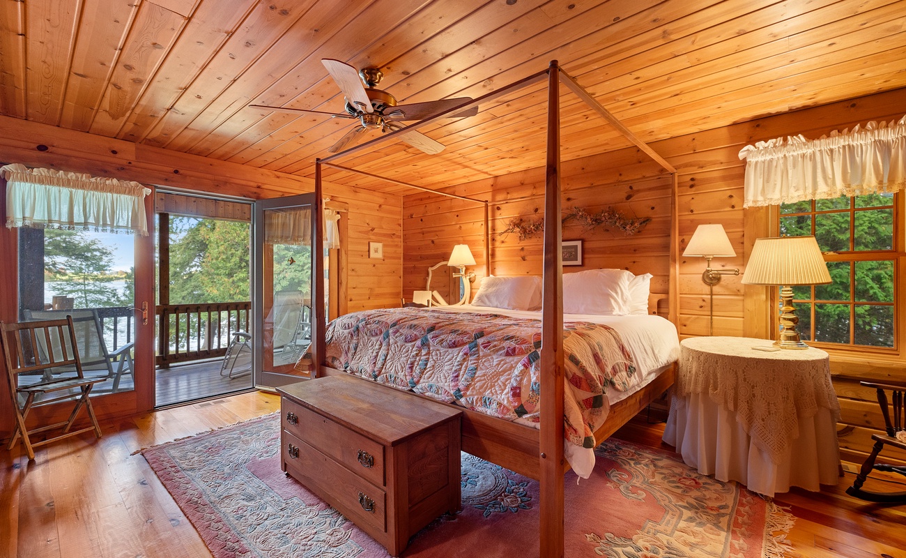 Primary bedroom is on the main level and has a king-size bed.