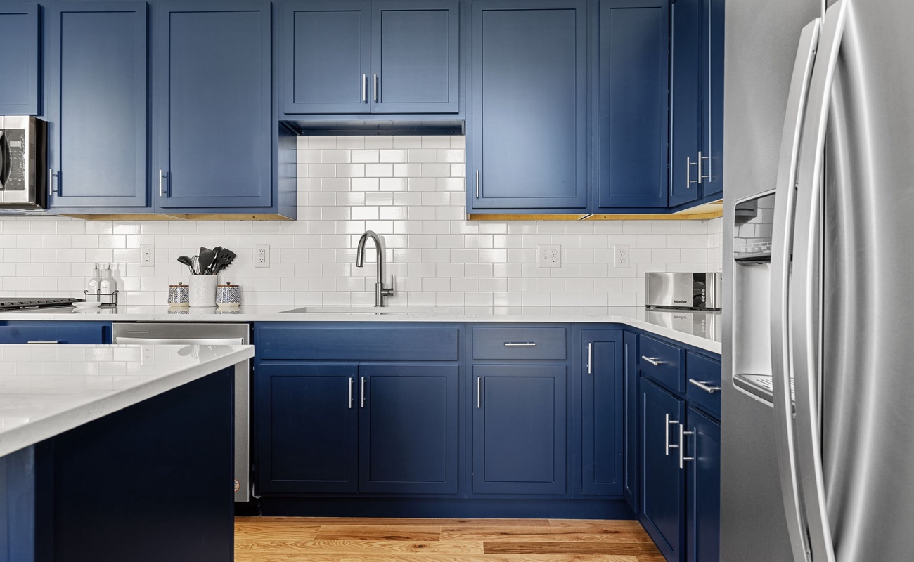 Custom cabinets + tile back splashes, stone counters, stainless appliances. Yep.