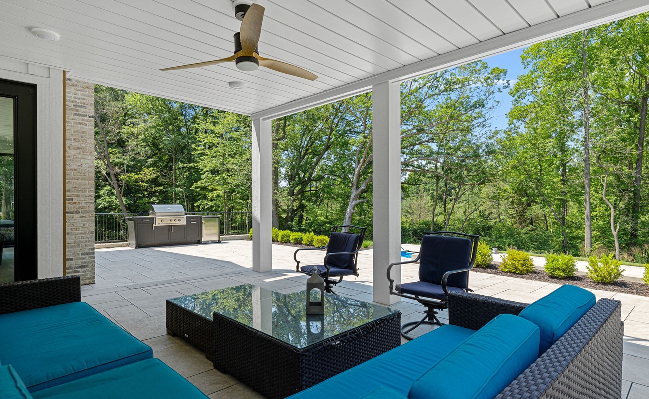 Lounging in style on these chic blue couches under the gentle breeze of the ceiling fan.