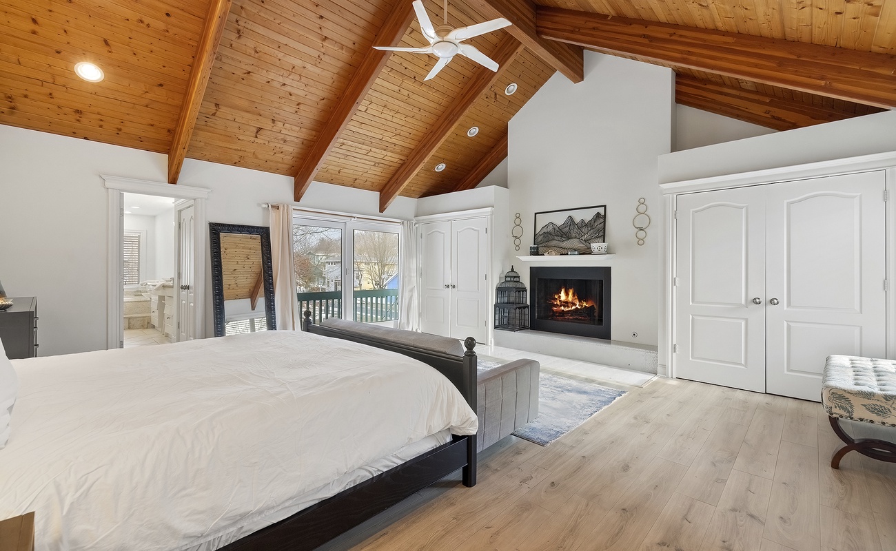 Wake slowly with soft morning light in the signature suite (fireplace not available for guest use).