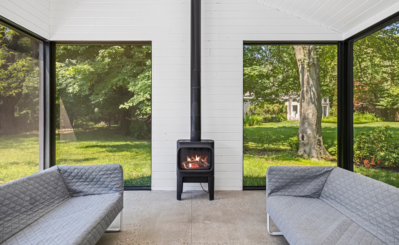 An electric fireplace keeps the ambiance warm on cool evenings.