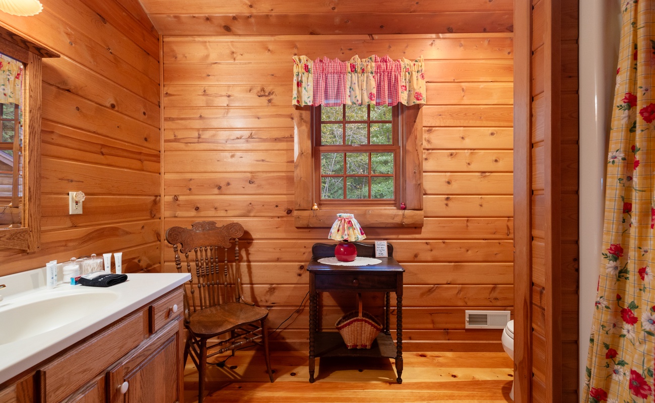 This charming bathroom has everything you need to unwind after a day of vacation fun.