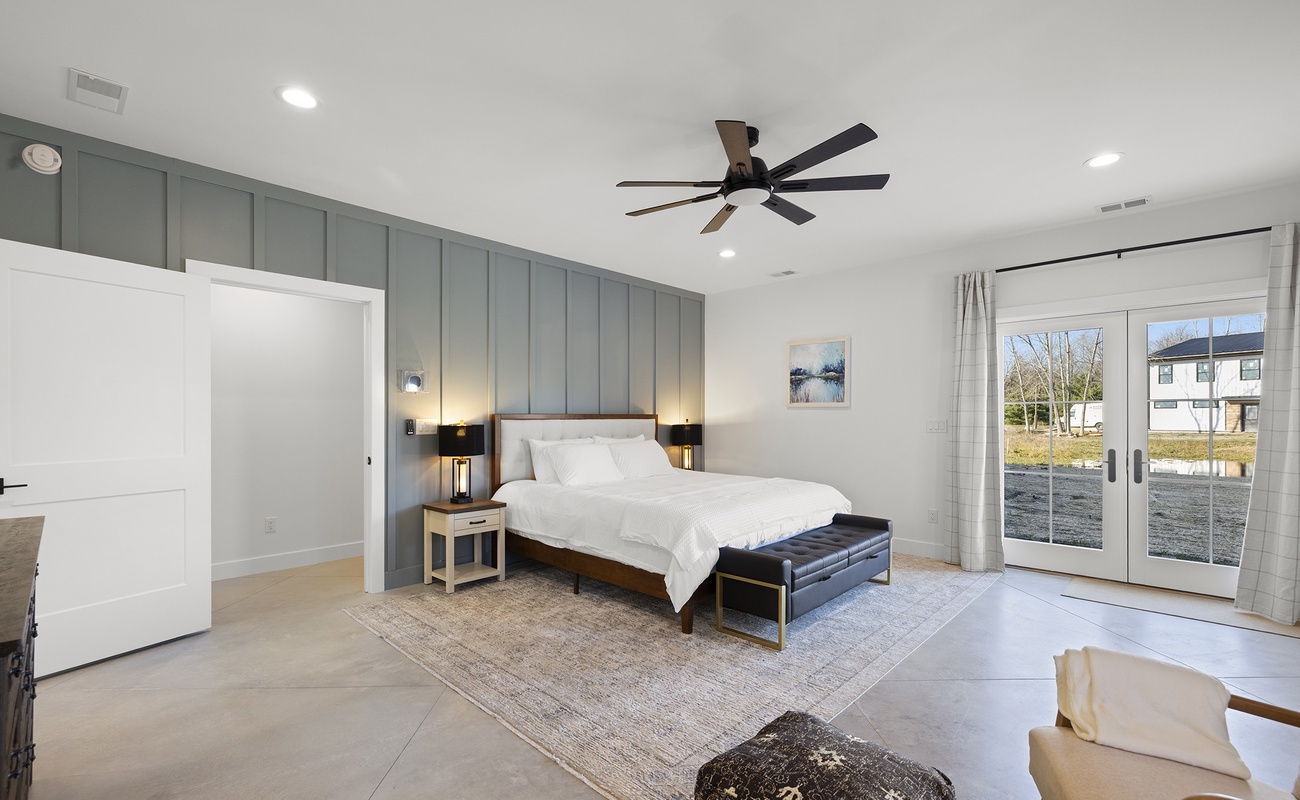 Primary bedroom is on the lower level and has a king-size bed.