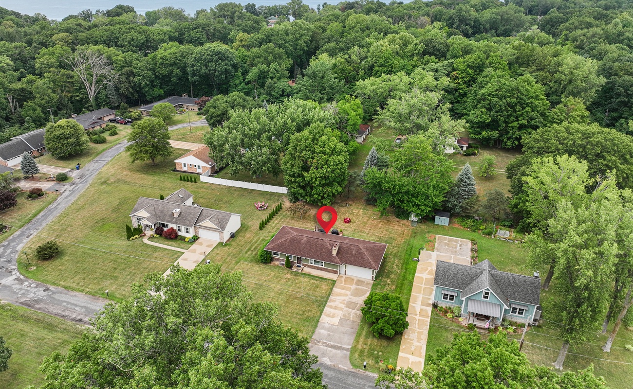 Nestled among trees and a tranquil lake, this is your perfect escape.