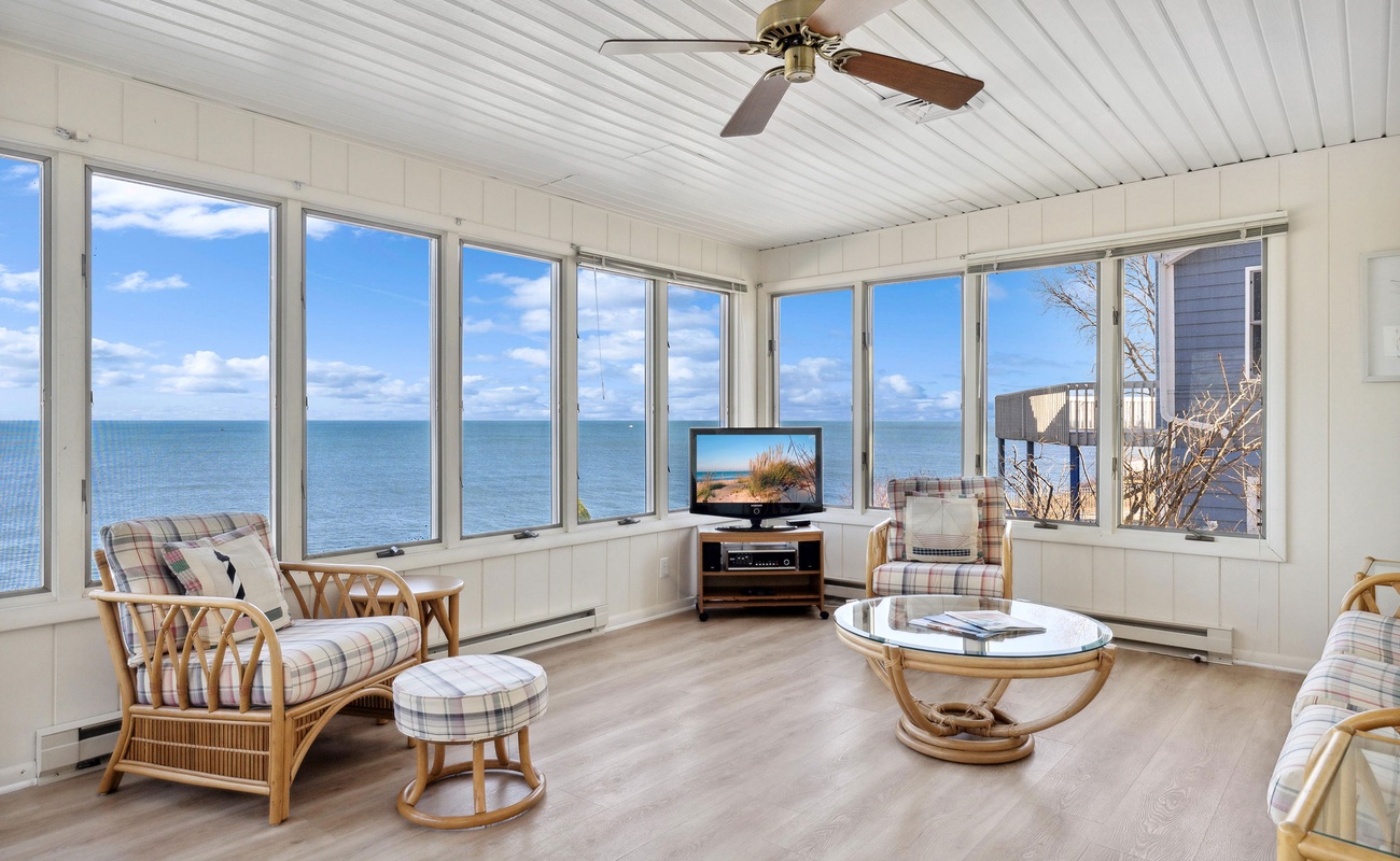 This cozy space offers the perfect spot to unwind and catch up on your favorite shows.