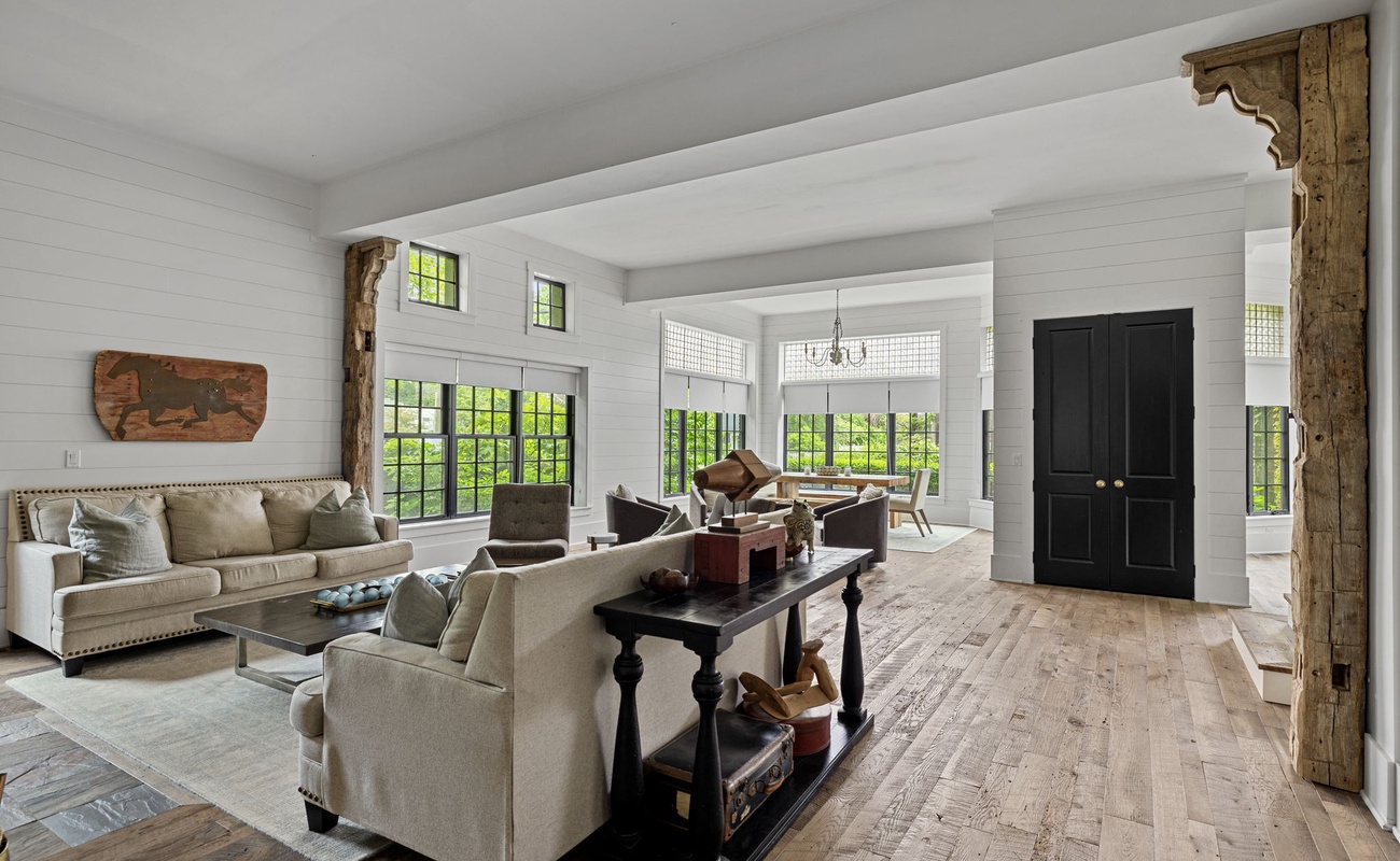 The Black Door Bungalow is filled with gorgeous, reclaimed wood flooring and antique beams.