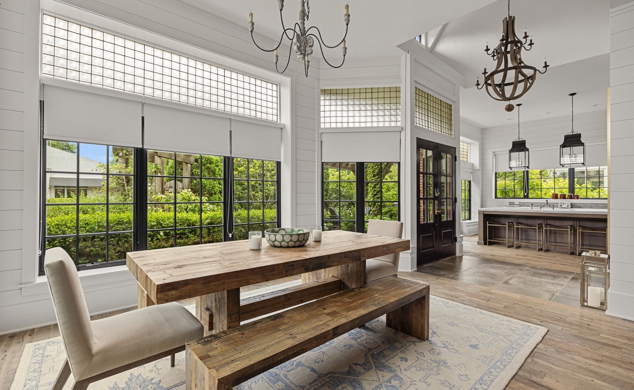 Dine in light-filled luxury under antique French window transoms with original glass block.