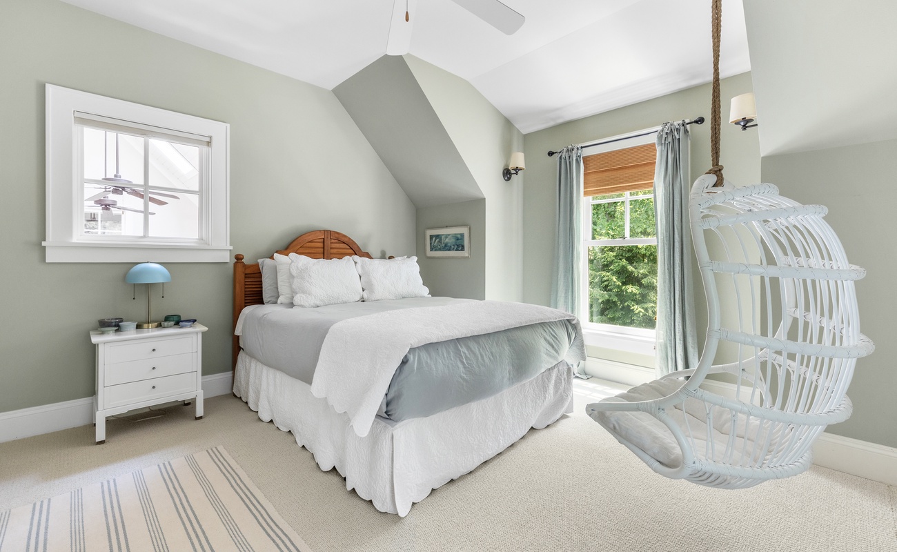 Swing into relaxation in this comfort bedroom with a playful twist.