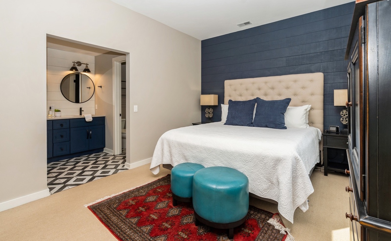 Tufted headboard. Velvet stools. Pure bliss.