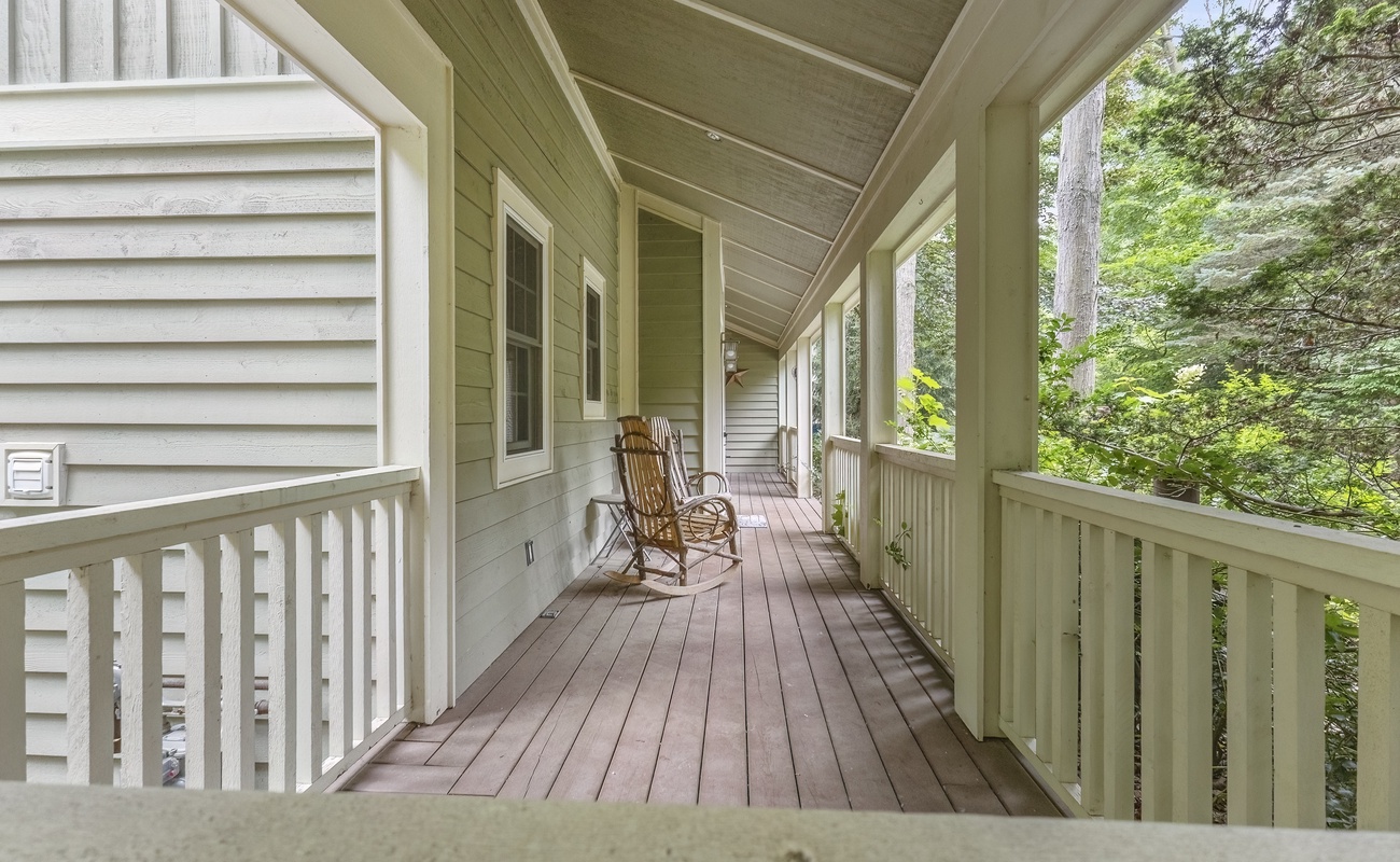 Gently rockin' on a porch in a one-of-a-kind rocking chair. Vacation Heaven.