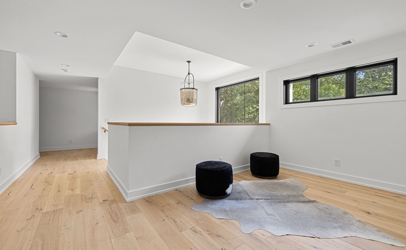 When life feels like a blank canvas, find solace in a white room with hardwood floors and let your imagination run wild.