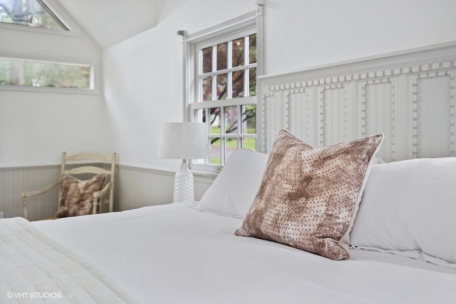 Primary bedroom is on the main level & has a king-size bed.