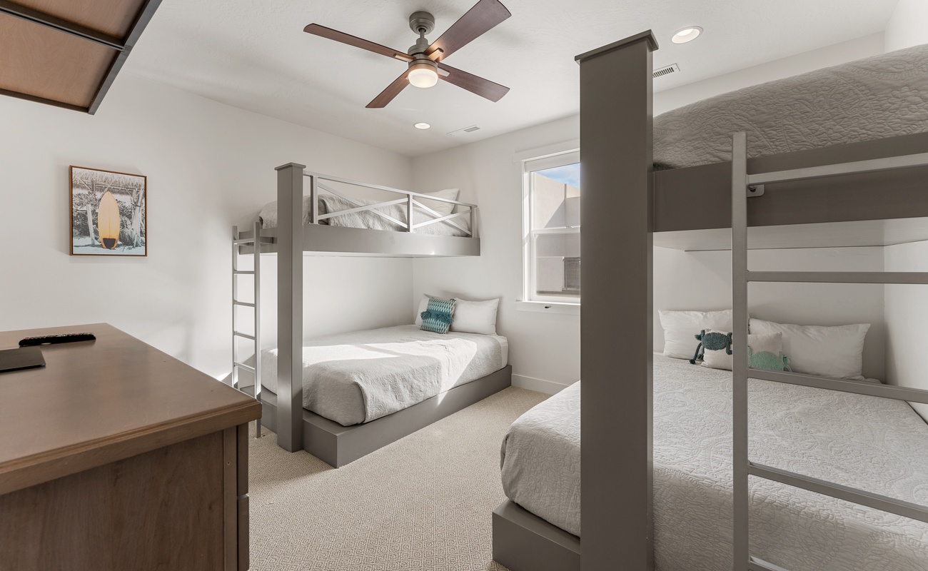 Your group will love this stylish bunk room with four comfortable beds, perfect for kids or friends sharing adventures together.