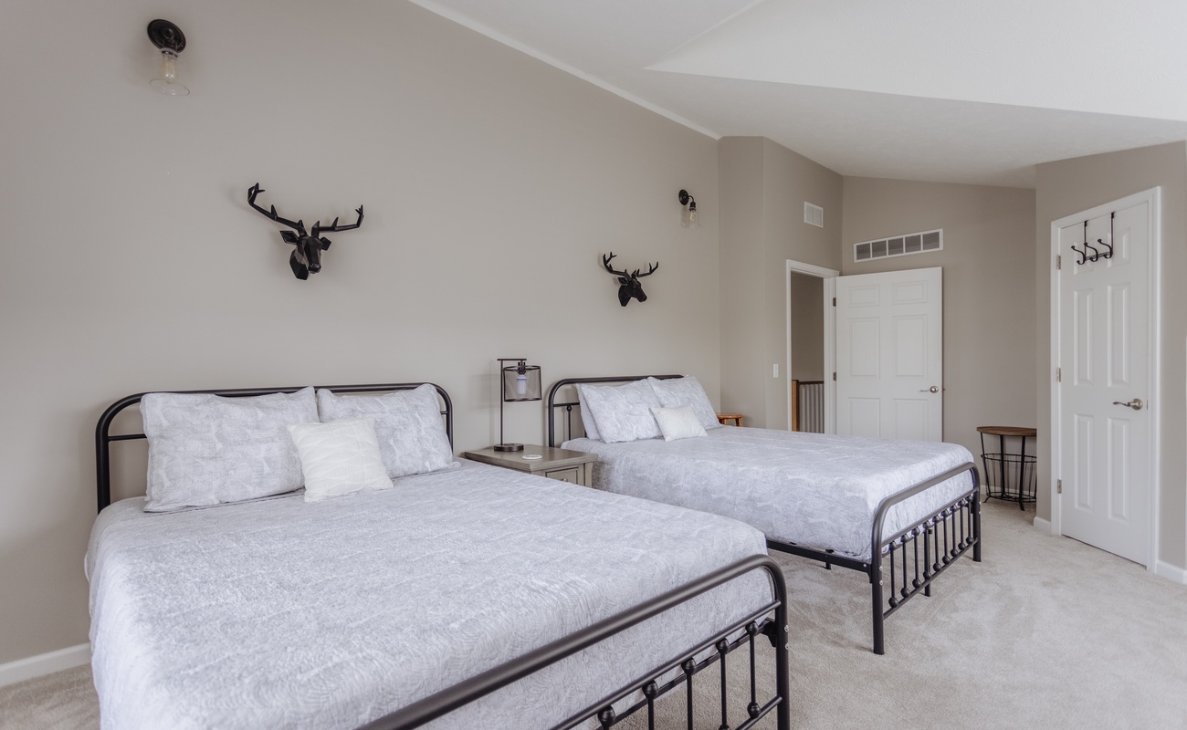 2 queen beds in the upstairs Bedroom