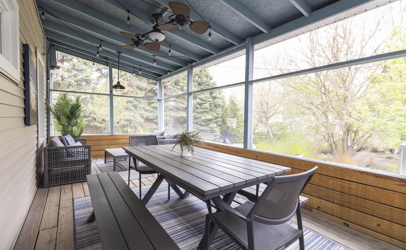 Charming dining and seating in the screen porch