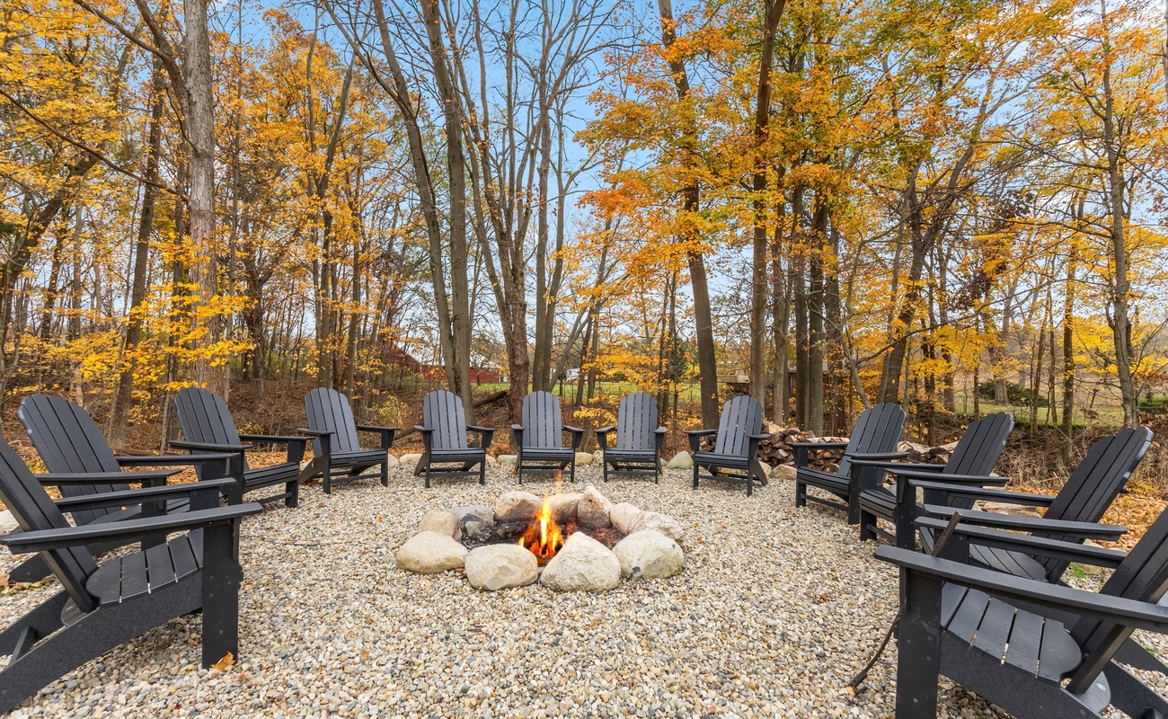 Fire pit area with twelve Adirondack chairs