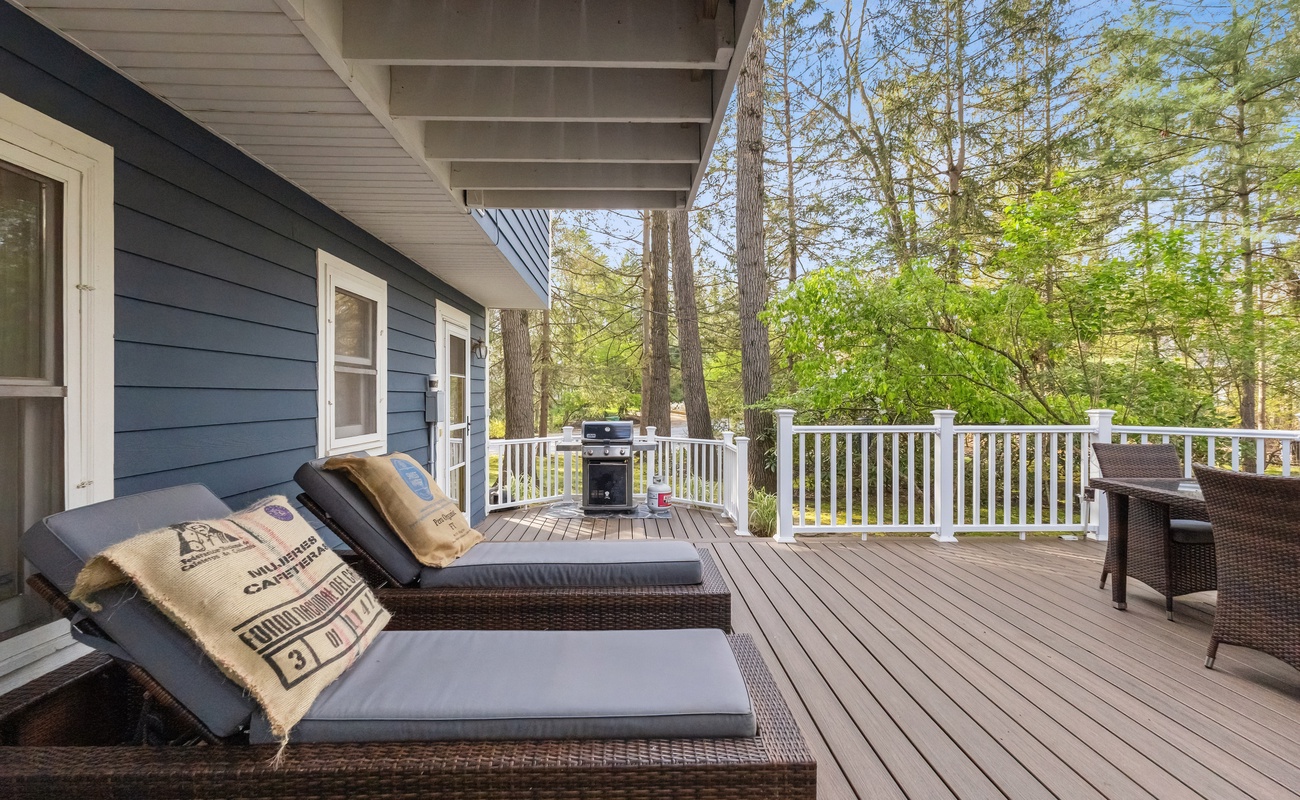 Relax in the chaise lounge chairs on the back deck, a perfect retreat for rest and relaxation.