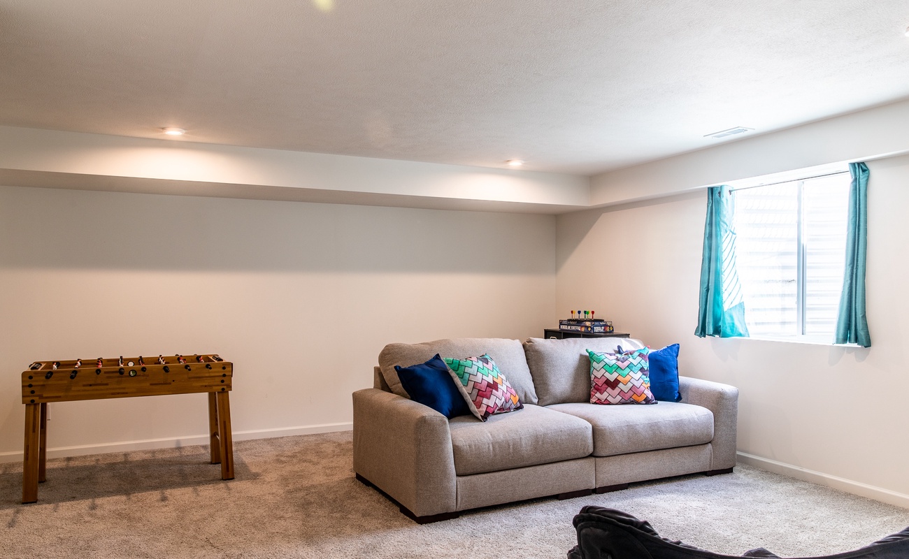 Fun basement playroom with seating